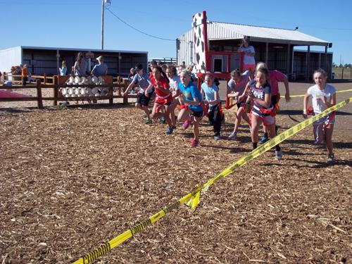 Seventh graders take off at the starting line. Photo by Megan Moore.