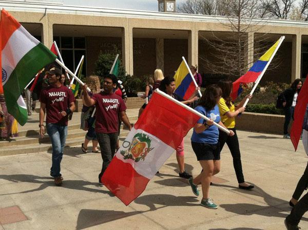 International students march in the parade of flags. Photo by John Lee.