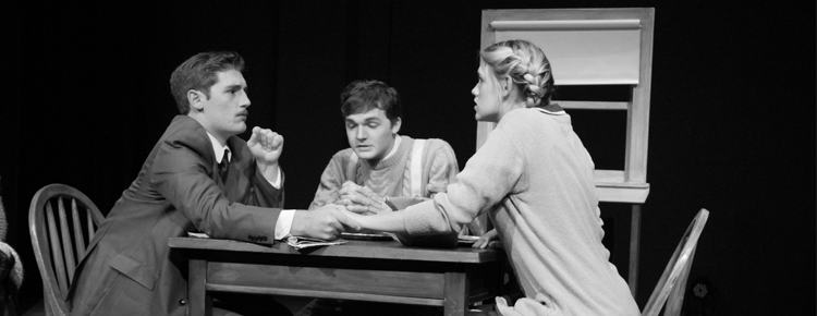 Richard Hannay (left), played by Brandon Dawson, pleads silence from Margaret (right), played by Rachel Townsen during evening prayers with Crofter (center), played by Dakota Brown. 