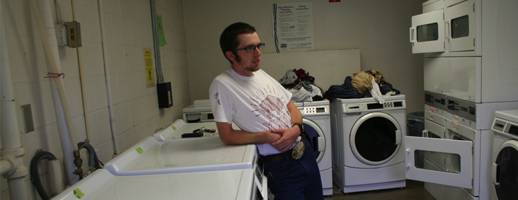 Freshman Mechanical Engineering major Marcus Preuninger waits for his laundry to finish.
