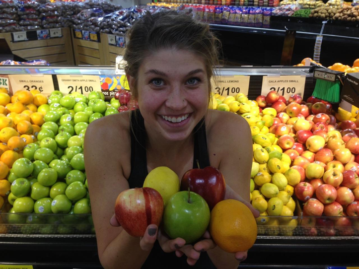 Elissa Betts, an NSCA-Certified Personal Trainer, shows the wide variety of fruits at United Supermarket in Canyon, Texas.