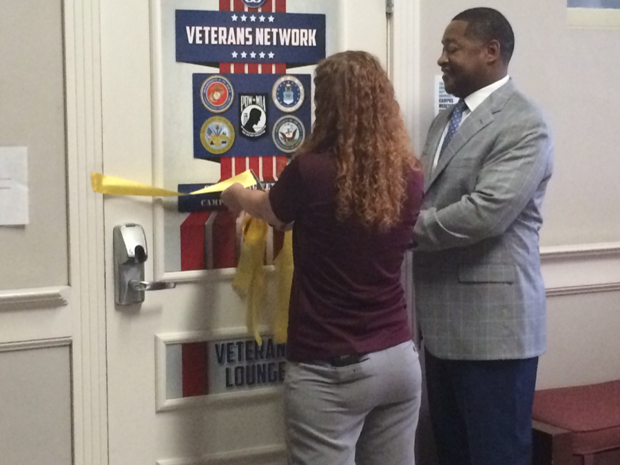 Leo Reid Jr., director of WTAMU Veterans Services, and Kristen Randal, president of the Veterans Network on campus, cut the ribbon for the grand opening of the Veterans Lounge. 