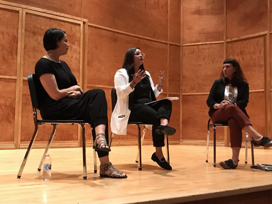Poets Amezcua and Chavez speak with Jacuinde during a discussion.