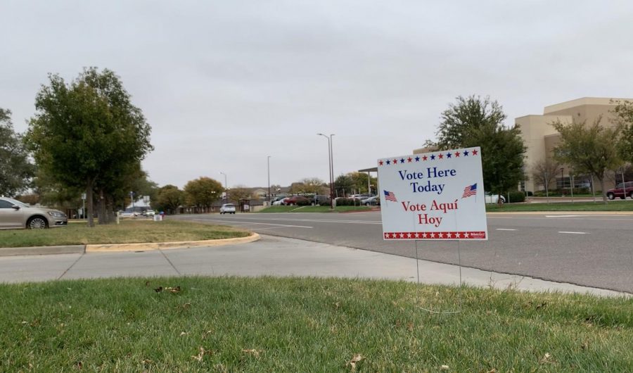 Canyon, TX – Nov 2, 2021: Residents and college students drive by the Randall County Justice Center on Russell Long Blvd while passing several yard signs encouraging for voters to vote against Amarillo Proposition A.