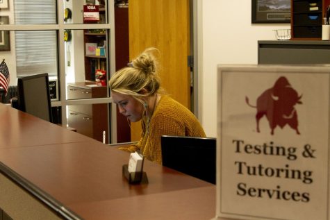 Katelynn Kenyon reviews work at the Testing and Tutoring Services in the Classroom Center. Photo taken March 9, 2022.