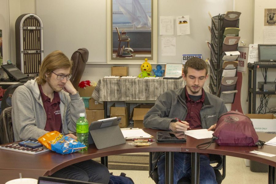 From left to right: Jonathan Arthur and Ryan Riggins do homework while waiting for students to come into the Writing Center. Photo taken March 9, 2022. 