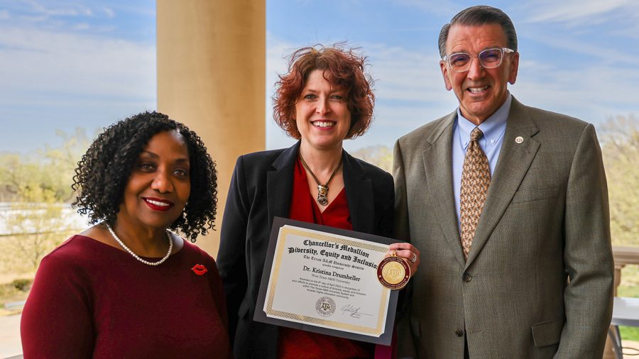 Dr. Kristine Drumheller, center, is presented a certificate and medal as the winner of a Chancellor’s Medallion for Diversity, Equity and Inclusion by WT President Walter V. Wendler, right, and Angela Allen, chief officer for diversity and inclusion. Photo provided by WT Communication and Marketing