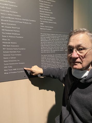(Dr. James Calvi visited the Flight 93 memorial recently and is posed next to West Texas A&M Universities name at the Visitor Center Complex.