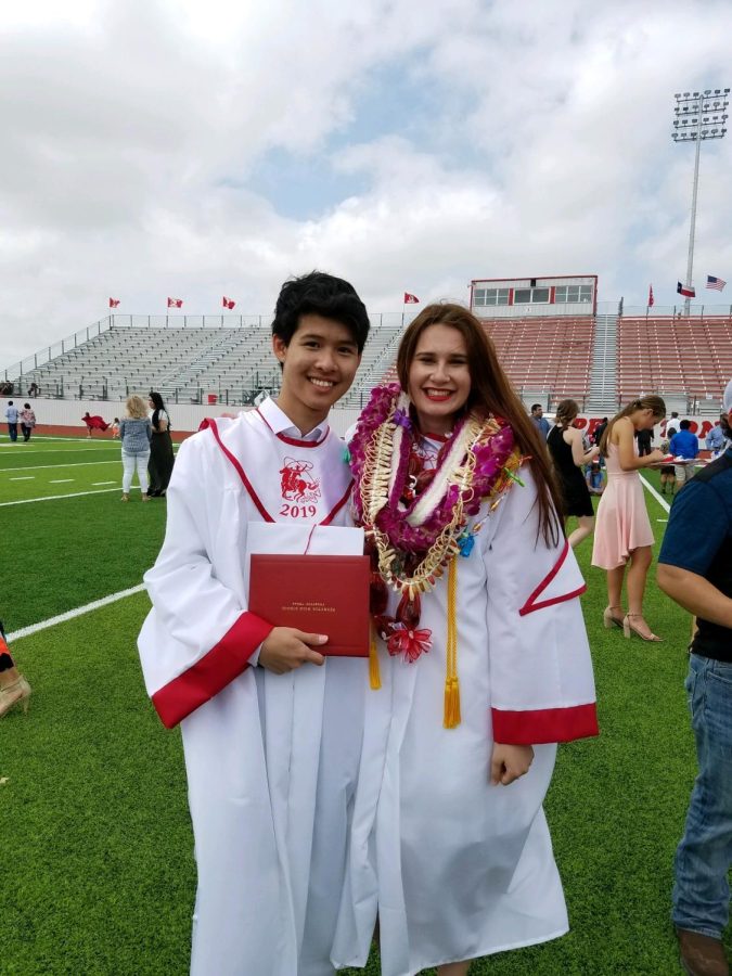 Ashlynn+Lester%2C+right%2C+poses+with+a+friend+at+their+Perryton+Highschool+graduation+in+2019+and+wearing+a+traditional+Hawaiian+Lei.+