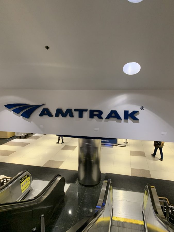 Going down the escalators of Union Station in Chicago to the rail lines from street level is the Amtrak sign that passengers pass by on their way to the train, Nov. 22, 2022. 
