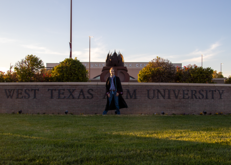 Marcus Rogers stands in front of the West Texas A&M University sign with the First United Bank Canter in the background. (Nov. 1, 2022)