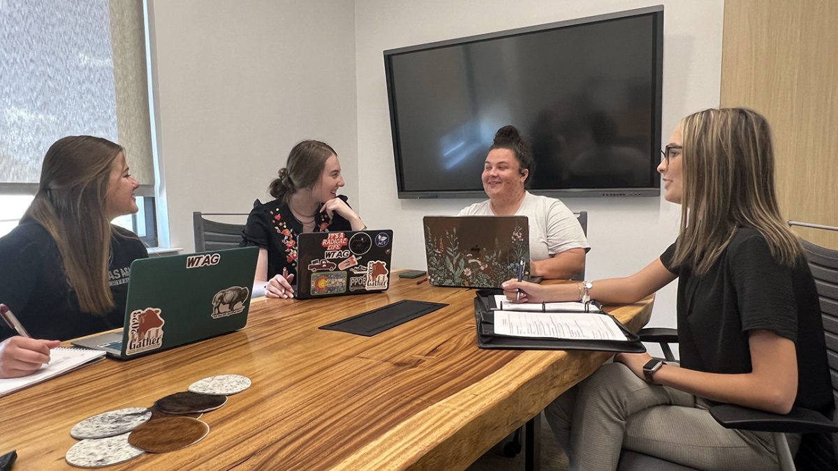 Dr. Chelsea Arnold, second from right, leads a meeting with student organizers of the Fall Gather, including Jayci Mekelburg, from left, Macy Downs and McKinley Begert.