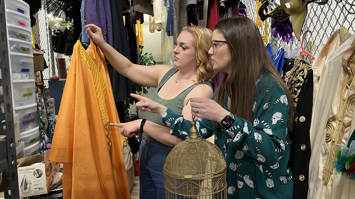 Sarah Beckham-Turner, right, and recent graduate Chloe Ridolfo pick out props and costumes for possible use with Manhattan Opera Studios upcoming staging of The Magic Flute. Beckham-Turner, director of WT Opera, will direct the MOS production, and five of her current and former students will attend the workshop and perform in it. 