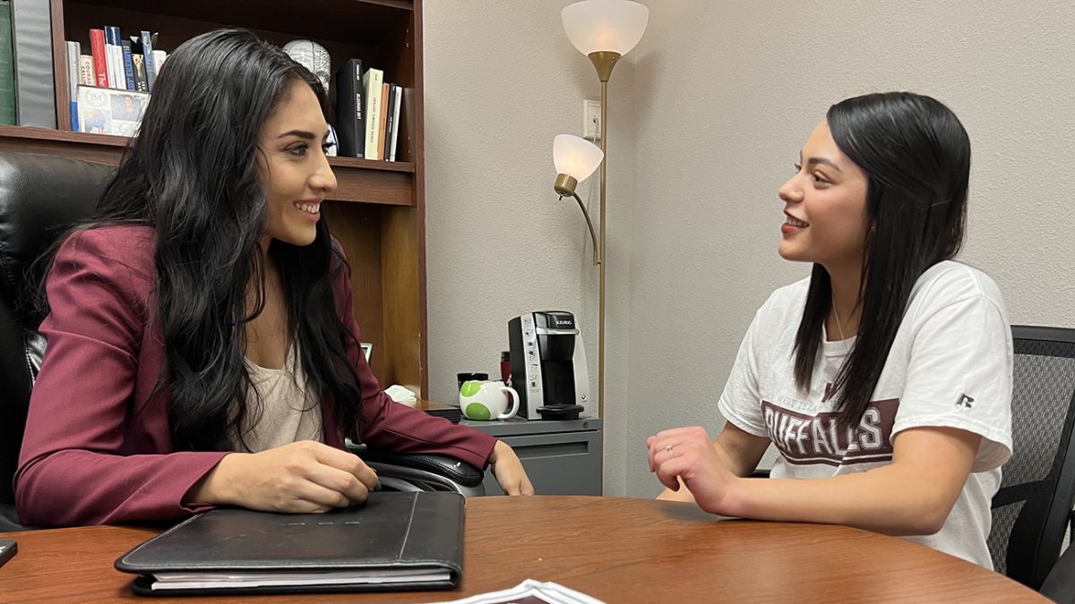 Jeanette Arpero, instructor of criminal justice, discusses career options with Adrianna Nuñez, a freshman criminal justice major from Abernathy. WT's criminal justice program will host a career fair Oct. 4 for students and community members.