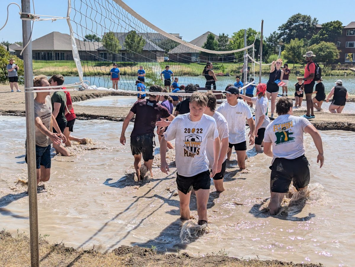 Participants at Mudfest shake hands after the end of their game on Sept. 13, 2024