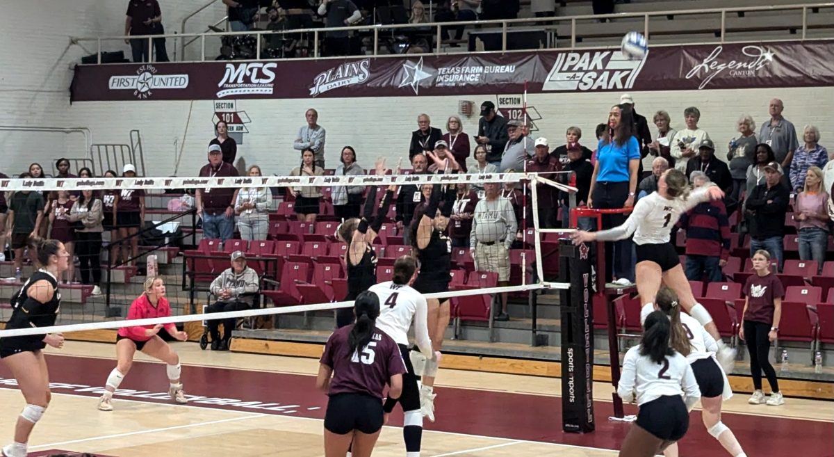 Emma Becker leaps up to make the game winning kill against the Cameron University Aggies on Oct. 30 inside the Fieldhouse "The Box."