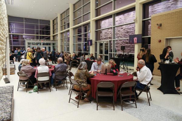 Students and guests gather to eat before the communication departments' presentations.  